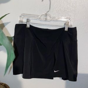 Size medium Nike black tennis skirt/skort with built in shorts.
